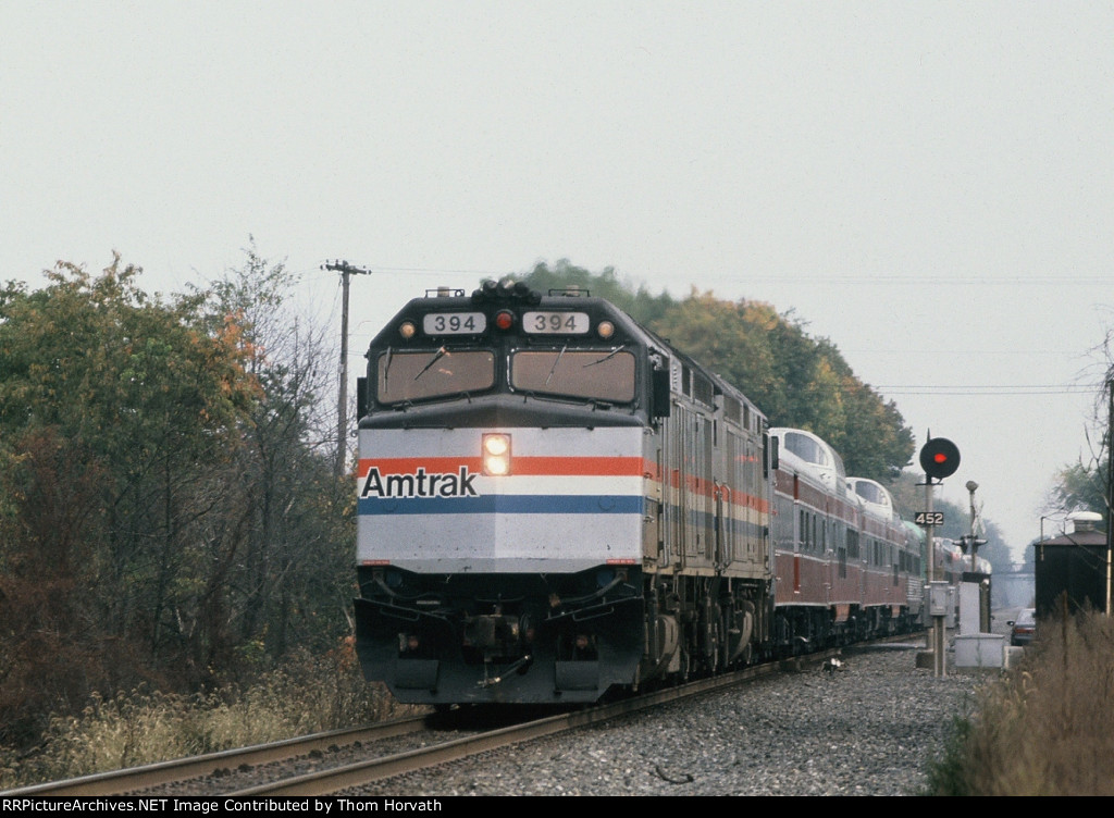 AMTK 394 heads up a train of private varnish heading west on the LEHL